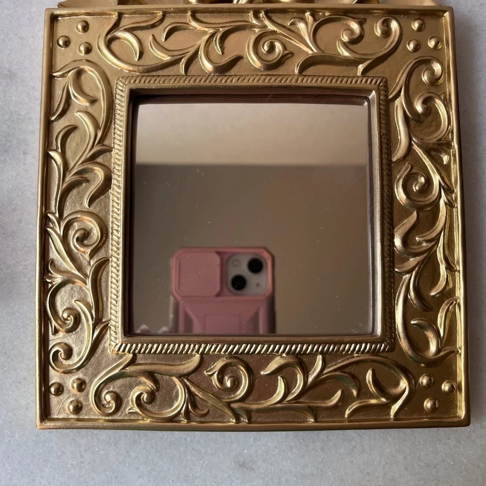 Vintage ornate gold wall mirror, accent mirror. Bow decorated frame
